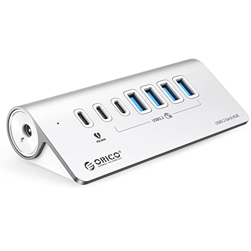 USB hub with seven ports including six USB 3.2 data ports and one PD charging port, featuring a 10Gbps transfer speed, a 24V 3A power adapter, and a 1.64-foot USB-C to USB-C cable along with a USB-A adapter.