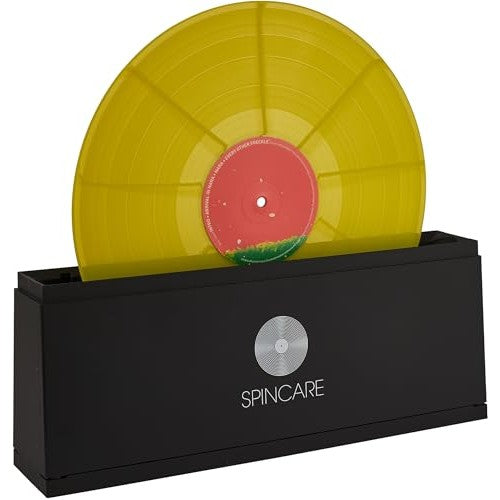 Image of a Spincare record cleaning system including a washing basin, drying rack for 10 records, two super soft velvet cleaning brushes, two bottles of proprietary cleaning solution (150 ml each), two microfiber drying cloths (30 cm x 30 cm), and brush rollers. The set is designed to clean approximately 500 vinyl records efficiently.