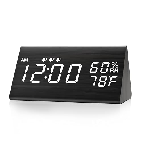 Digital alarm clock featuring a wooden design with an LED time display, offering three alarm settings and capabilities to detect humidity and temperature, suitable for bedroom or bedside use in black color.