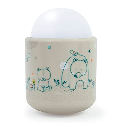 Portable night light designed for babies and children featuring soft LED illumination, offering 70 hours of battery life without the need for batteries or wires, rechargeable via plug, set against a woodland backdrop.