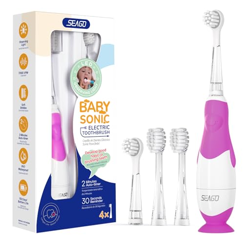 Electric toothbrush for babies aged 0 to 3 years featuring a smart timer and suction base, includes four replacement heads in purple color.