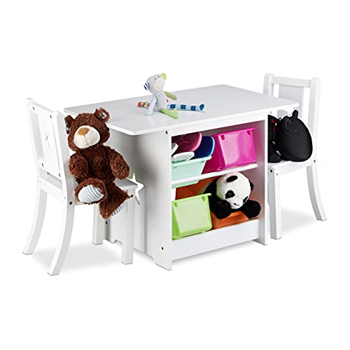 Children's table and chairs set in white wood designed for boys and girls, featuring a cozy sitting area for play and activities.