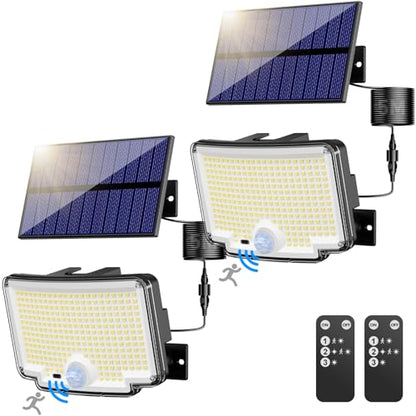 Two solar motion lights designed for outdoor use, featuring 6500K color temperature and 310 LEDs. The lights come with a remote control and are IP65 waterproof, making them suitable for gardens, patios, garages, yards, and backyards. The package includes two lights.