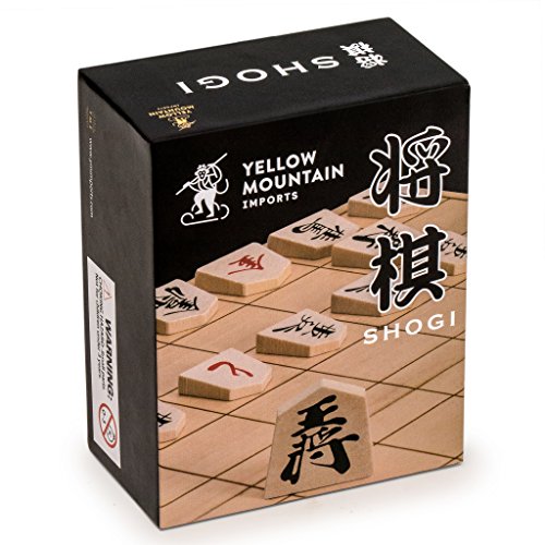 Wooden Shogi Japanese chess game set featuring traditional koma playing pieces and a paper shogiban board.