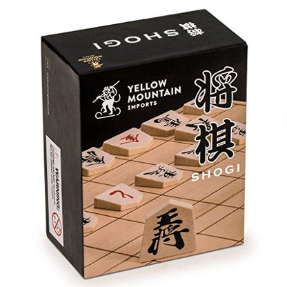 Wooden Shogi Japanese chess game set featuring traditional koma playing pieces and a paper shogiban board.