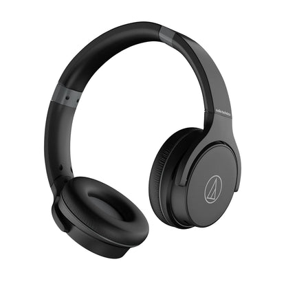 On-ear Bluetooth headphones by Audio-Technica in black, featuring sound isolation, lightweight design for comfort, and a long-lasting battery with up to 60 hours of use. Includes multipoint pairing capability and wired option with a 1.2 m cable that has an in-line mic and control. Suitable for everyday listening, travel, cycling, running, and exercising; compatible with various devices including smartphones and gaming consoles.